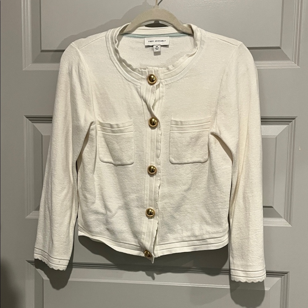 Cream cardigan with gold buttons and scallop detail